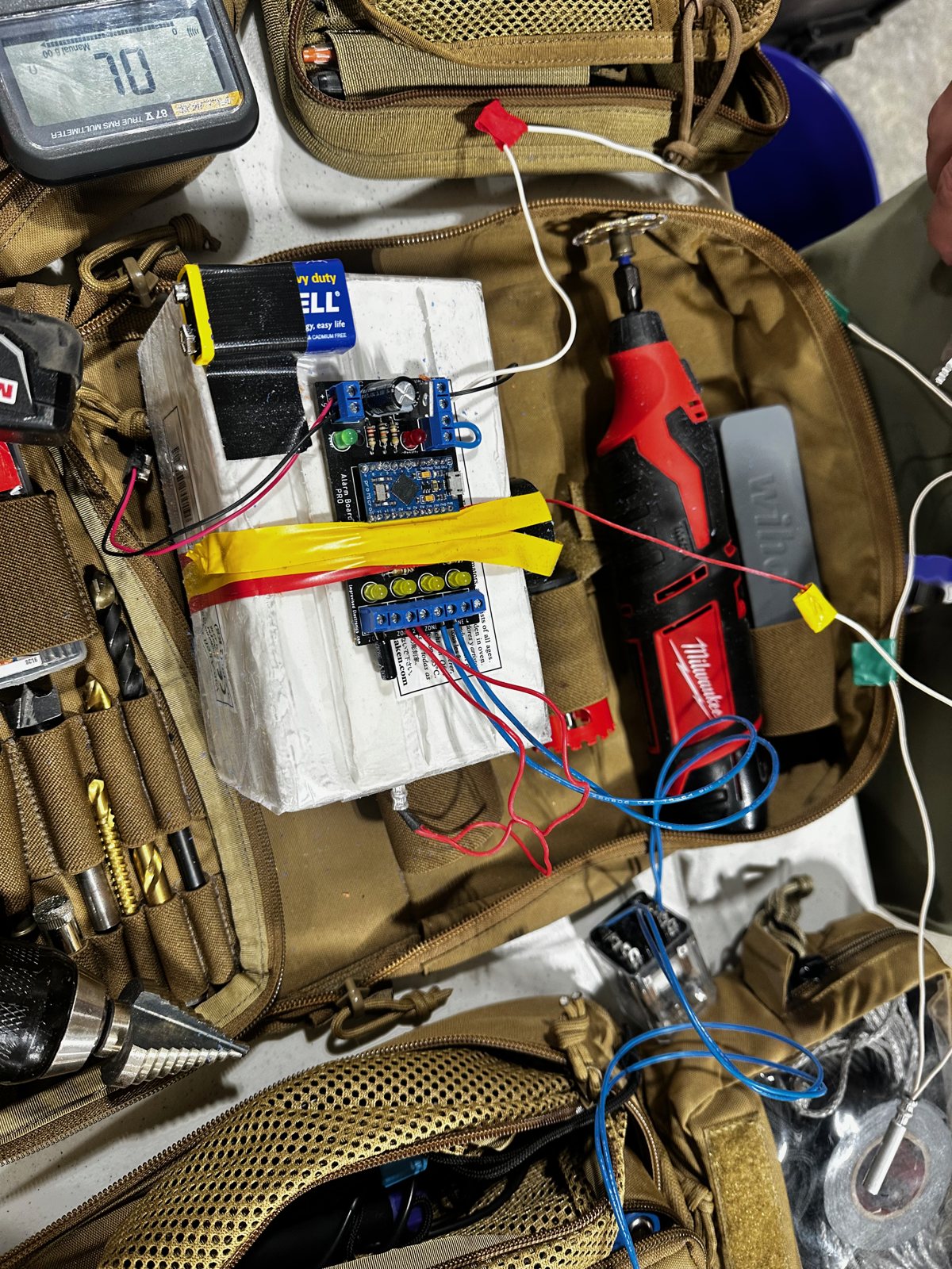 Internals of a purpose-built training device showing circuit boards and wiring